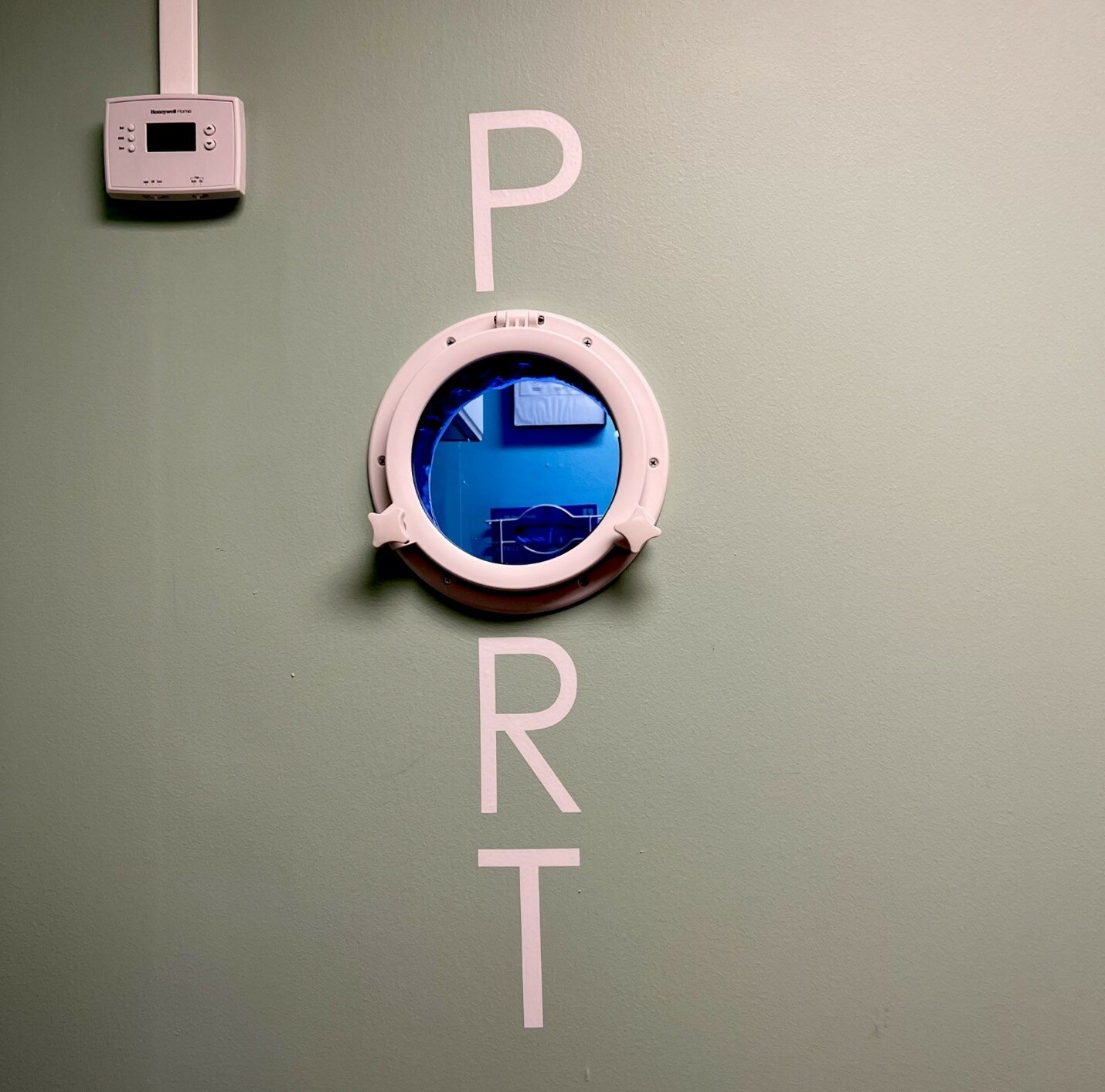 This clever porthole allows clients a view into the 'bio' room. As only personnel with training can legally enter, this gives a unique opportunity for those interested to view the autoclave and ultrasonics, how tools are processed, and where the chemicals are stored.
